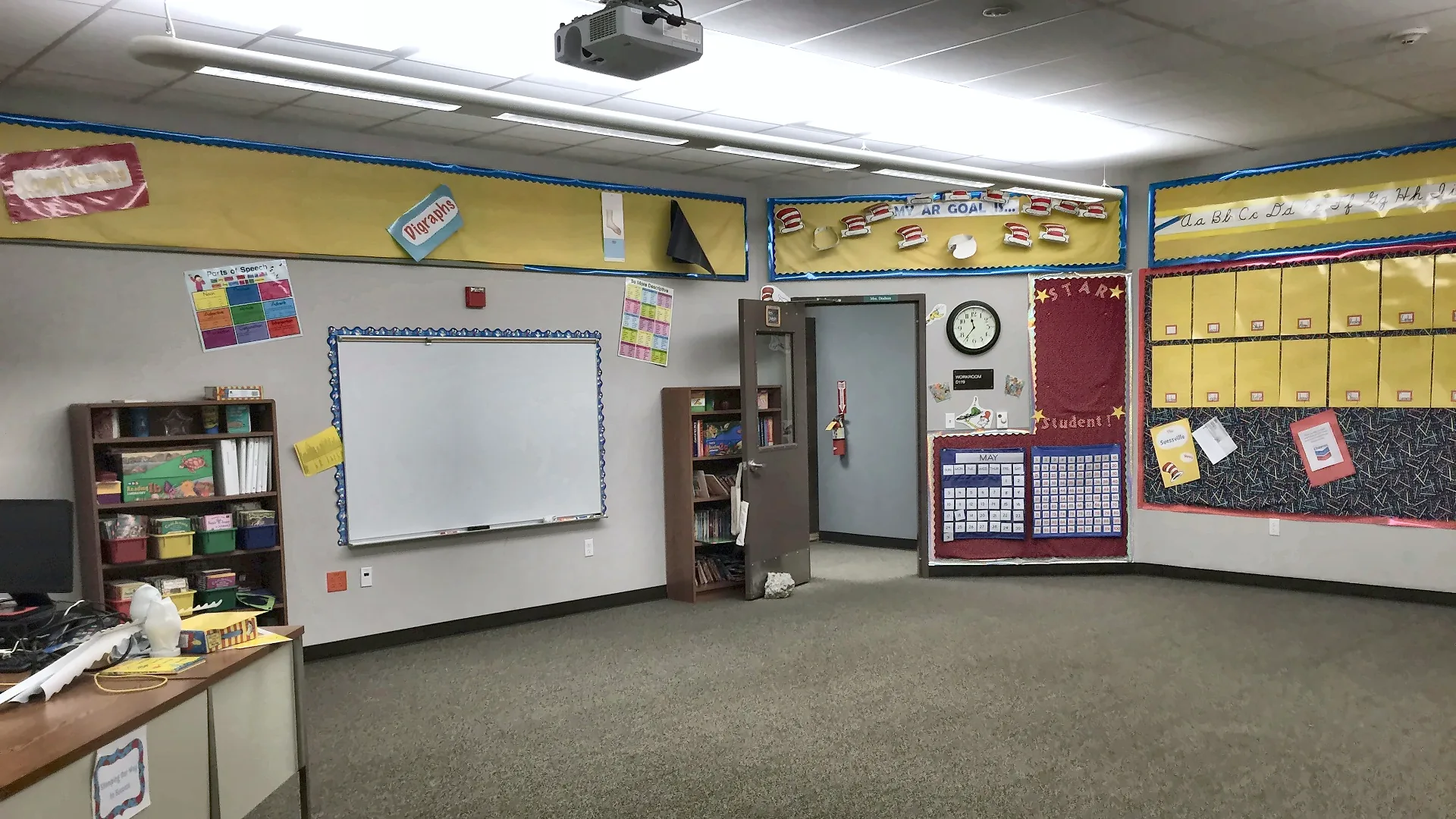 Elementary school classroom with whiteboard, bulletin boards and bookshelves in Northern California